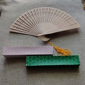 Pierced wooden oriental fan